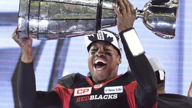 Henry Burris hoists Grey Cup, The Canadian Press Henry Burris hoists Grey Cup