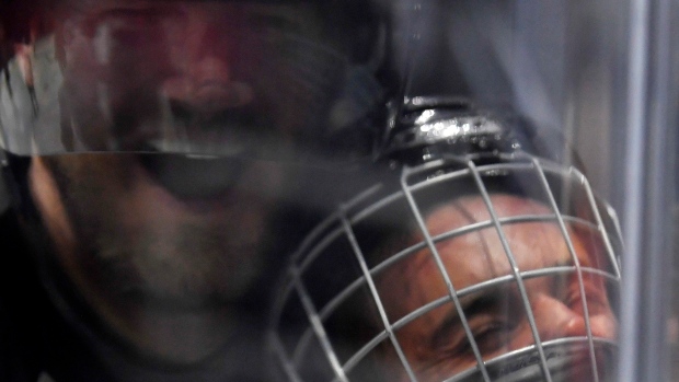 Justin Bieber gets hit, bounces back in celeb hockey game