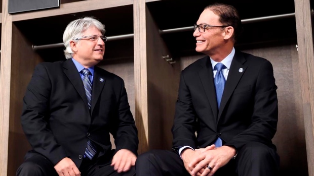 Jim Popp and Marc Trestman, The Canadian Press Jim Popp and Marc Trestman