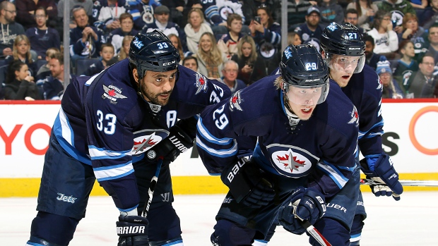 Dustin Byfuglien and Patrik Laine, Jonathan Kozub/National Hockey League/Getty Images Dustin Byfuglien and Patrik Laine