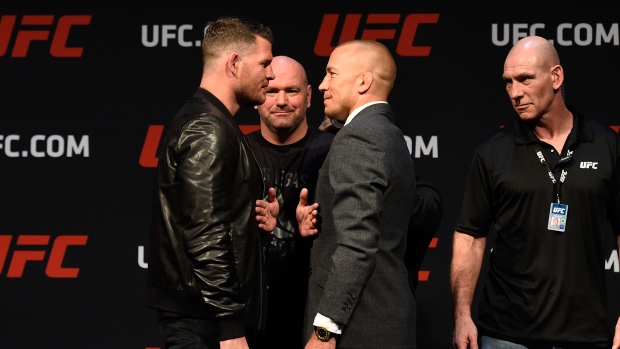 Michael Bisping and Georges St-Pierre, Josh Hedges/Zuffa LLC/UFC/Getty Images Michael Bisping and Georges St-Pierre