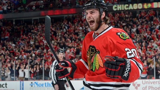 Brandon Saad looking happy in his new Blue Jackets jersey.