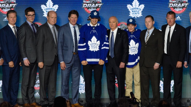 Timothy Liljegren with Maple Leafs management Timothy Liljegren with Maple Leafs management