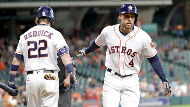 George Springer, Josh Reddick, The Canadian Press George Springer, Josh Reddick