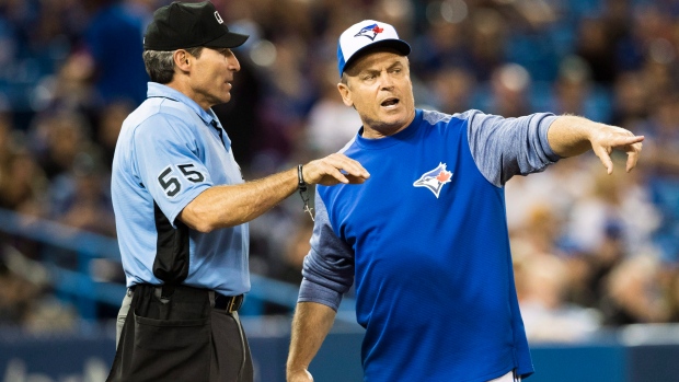 Angel Hernandez and John Gibbons, The Canadian Press Angel Hernandez and John Gibbons