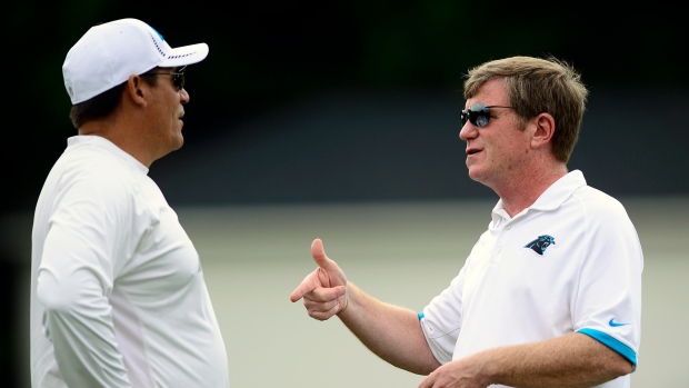 Ron Rivera and Marty Hurney, Charlotte Observer/Tribune News Service/Getty Images Ron Rivera and Marty Hurney