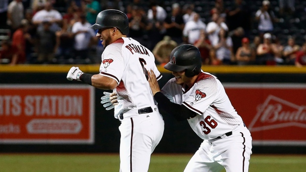 David Peralta and John Ryan Murphy celebrate