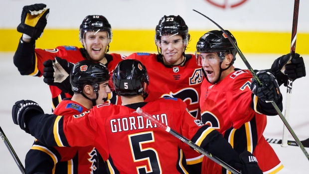 Calgary Flames celebrate goal, The Canadian Press Calgary Flames celebrate goal
