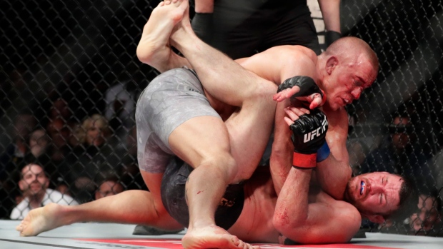 Georges St-Pierre Michael Bisping, The Canadian Press Georges St-Pierre Michael Bisping