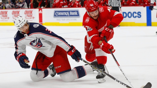 Seth Jones, left, Martin Frk, right 