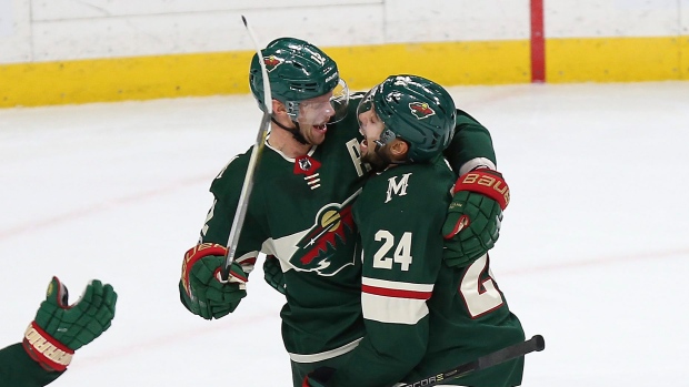 Eric Staal and Matt Dumba celebrate goal