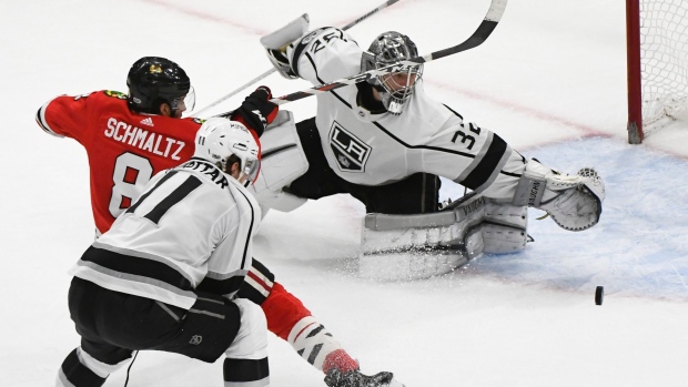 Jonathan Quick makes a save on Nick Schmaltz