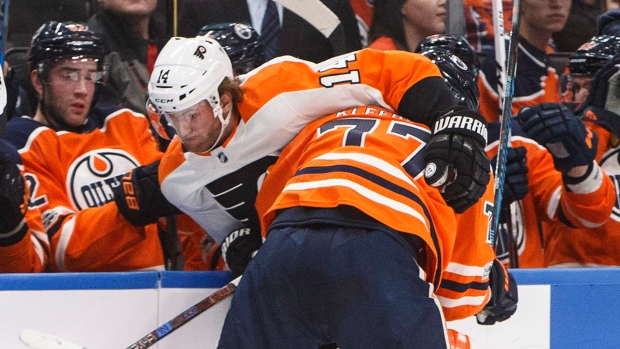Klefbom checks Couturier , The Canadian Press Klefbom checks Couturier