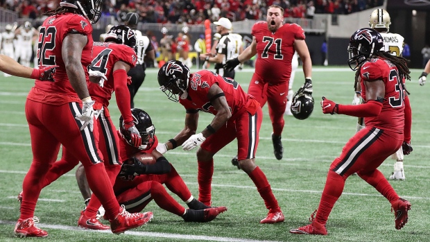 Falcons celebrate with Jones
