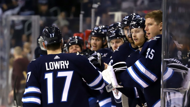 Adam Lowry and Jets Celebrate, Darcy Finley/NHLI via Getty Images Adam Lowry and Jets Celebrate