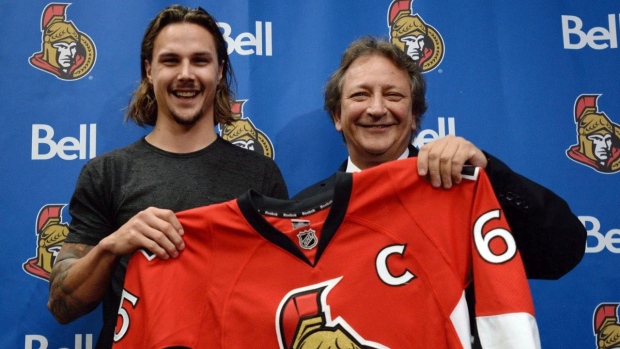 Erik Karlsson and Eugene Melnyk, The Canadian Press Erik Karlsson and Eugene Melnyk
