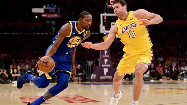 Brook Lopez guards Kevin Durant