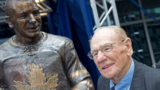 Johnny Bower with statue of himself