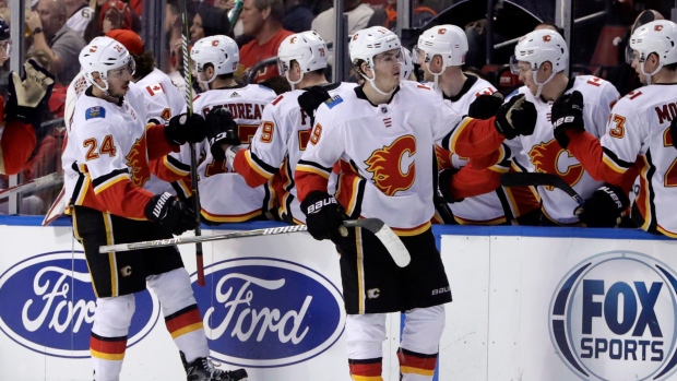 Calgary Flames celebrate goal, The Canadian Press Calgary Flames celebrate goal