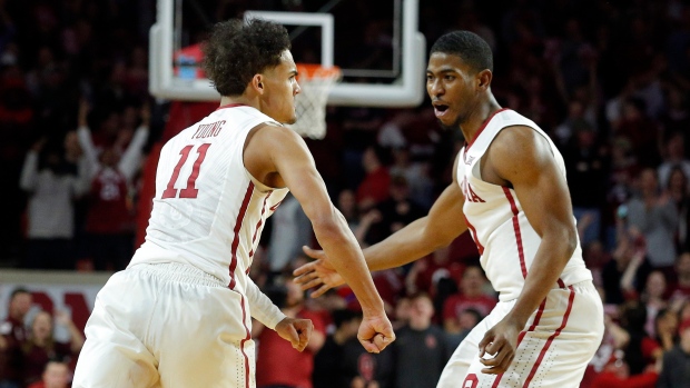 Trae Young and Christian James , The Canadian Press Trae Young and Christian James