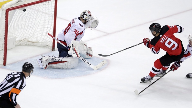 Taylor Hall scores past Braden Holtby