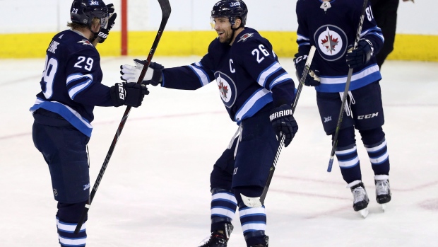 Patrik Laine, Blake Wheeler and Kyle Connor , The Canadian Press Patrik Laine, Blake Wheeler and Kyle Connor