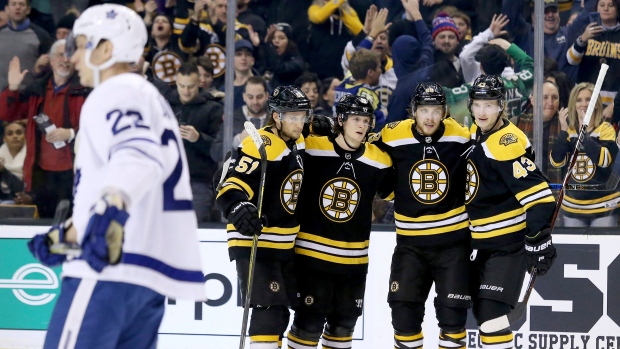 Bruins players celebrate, The Canadian Press Bruins players celebrate