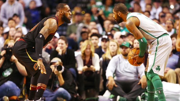LeBron James guards Kyrie Irving