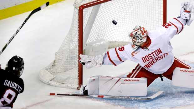 Adam Gaudette scores, The Canadian Press Adam Gaudette scores