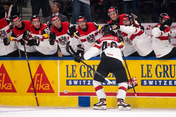 Austria beats Latvia for third straight win at Men’s Worlds; Norway shuts out Italy