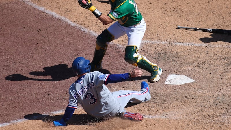 Rangers rally for four runs in 9th inning to beat Athletics