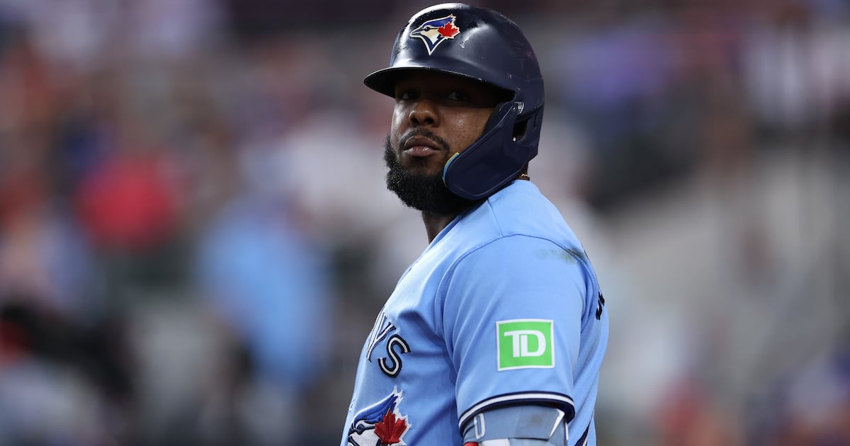 Photo: TSN ARLINGTON, TEXAS - SEPTEMBER 19: Vladimir Guerrero Jr. #27 of the Toronto Blue Jays looks on during the first inning against