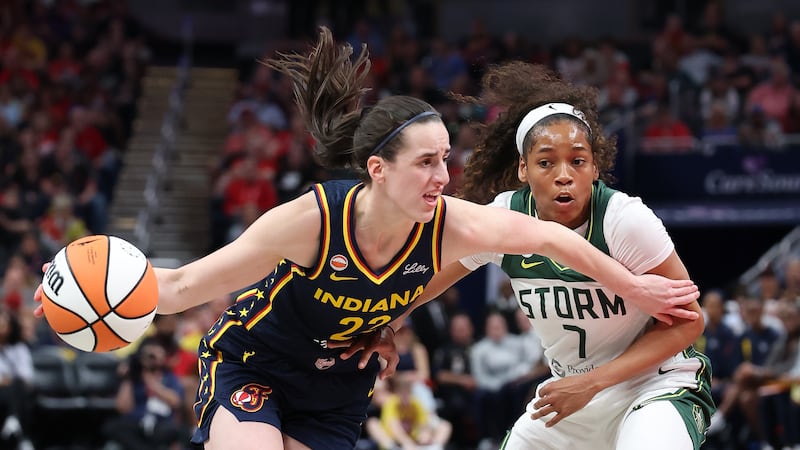 Clark has 21 points with 10 assists to lead Fever to win over Storm