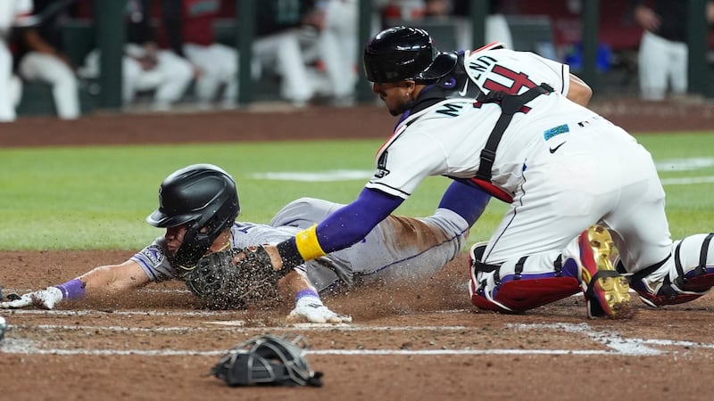 Carroll lines RBI single in ninth, Diamondbacks knock off Rockies for fifth straight win