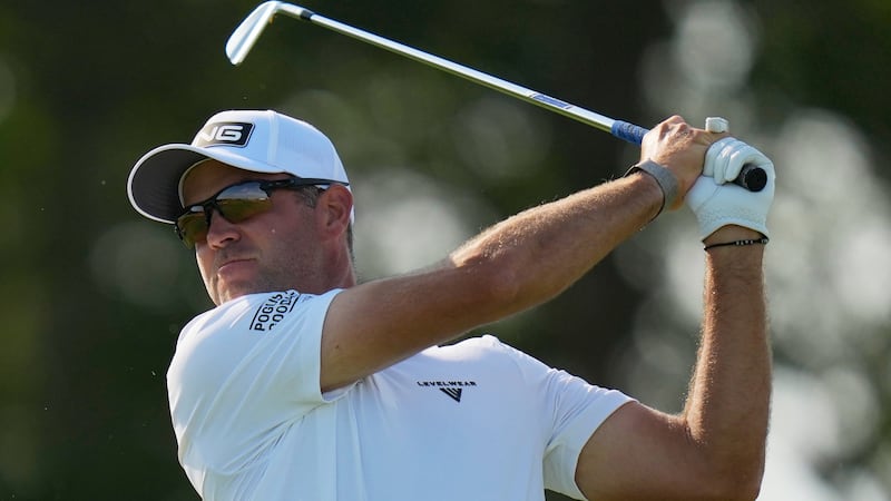 Conners battles wind to stay in the hunt at U.S. Open