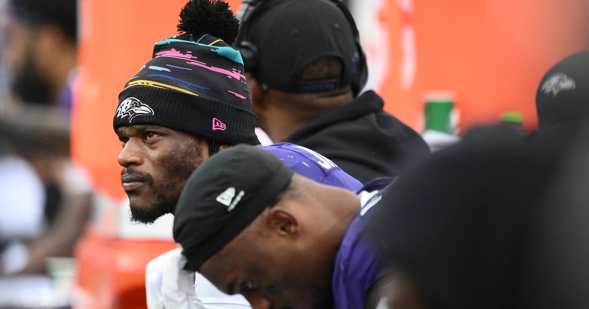 Photo: tsn.ca Baltimore Ravens quarterback Lamar Jackson, left, looks out from the bench during the second half of an NFL football game