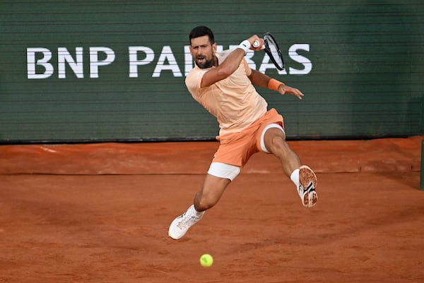 Djokovic overcomes slow start, hostile crowd in first-round win at Roland Garros