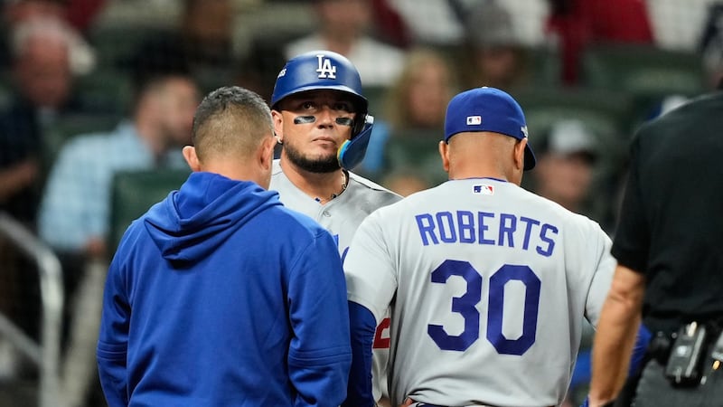 Dodgers hold out Rojas due to sore back, Acuña Jr. starting in RF for Braves