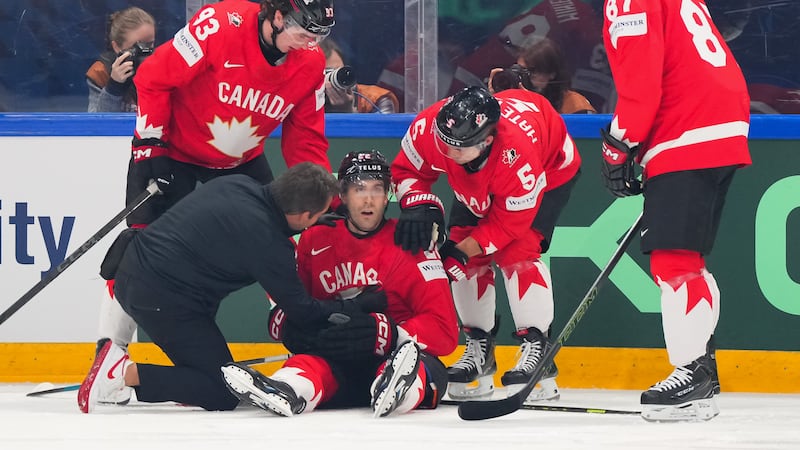 Canada’s Bouchard injured after taking illegal check to head from USA D Lindgren