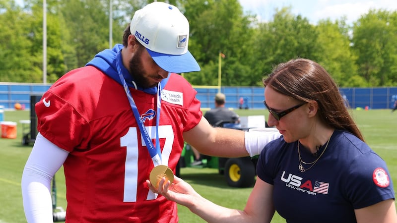 Scamurra gets a thrill showing off U.S. hockey gold with Allen at Bills practice