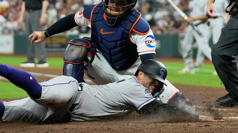 Goodman powers Rockies past Astros, snapping six-game skid