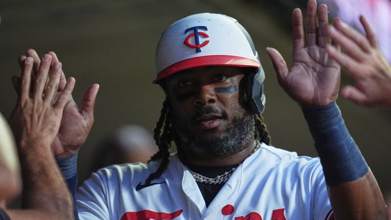 Bell has early two-run double, Twins bullpen hold lead for win over Braves