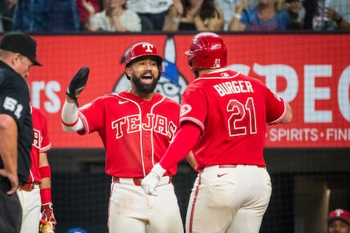 Burger’s homer, 3 RBI, lead Rangers past Mariners in AL West showdown