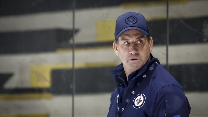 Jets' coach Arniel stickhandles around Hellebuyck's status