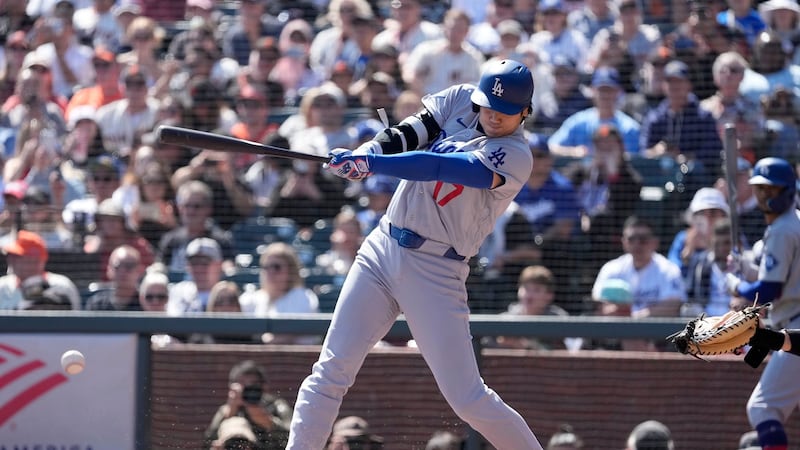 Pages’ three-run HR in 10th helps lift Dodgers to win over Giants