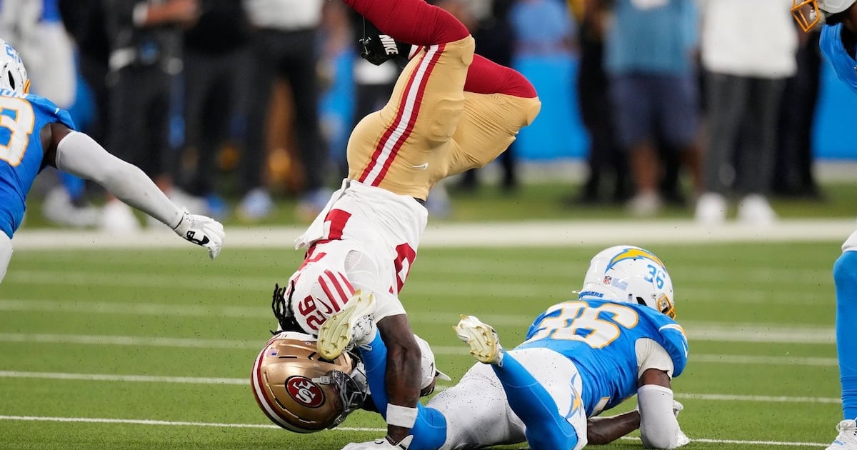 Photo: tsn.ca San Francisco 49ers running back Kaelon Black, left, is tackled by Los Angeles Chargers defensive back Avery Smith during
