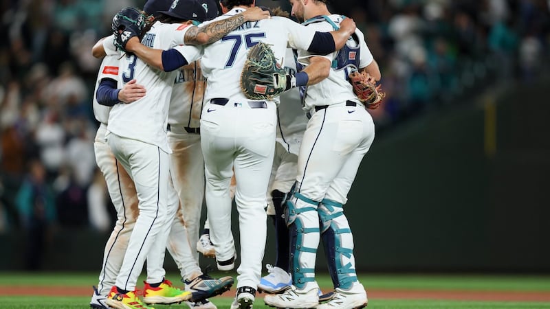 Mariners have big sixth inning to back Woo in victory over Angels
