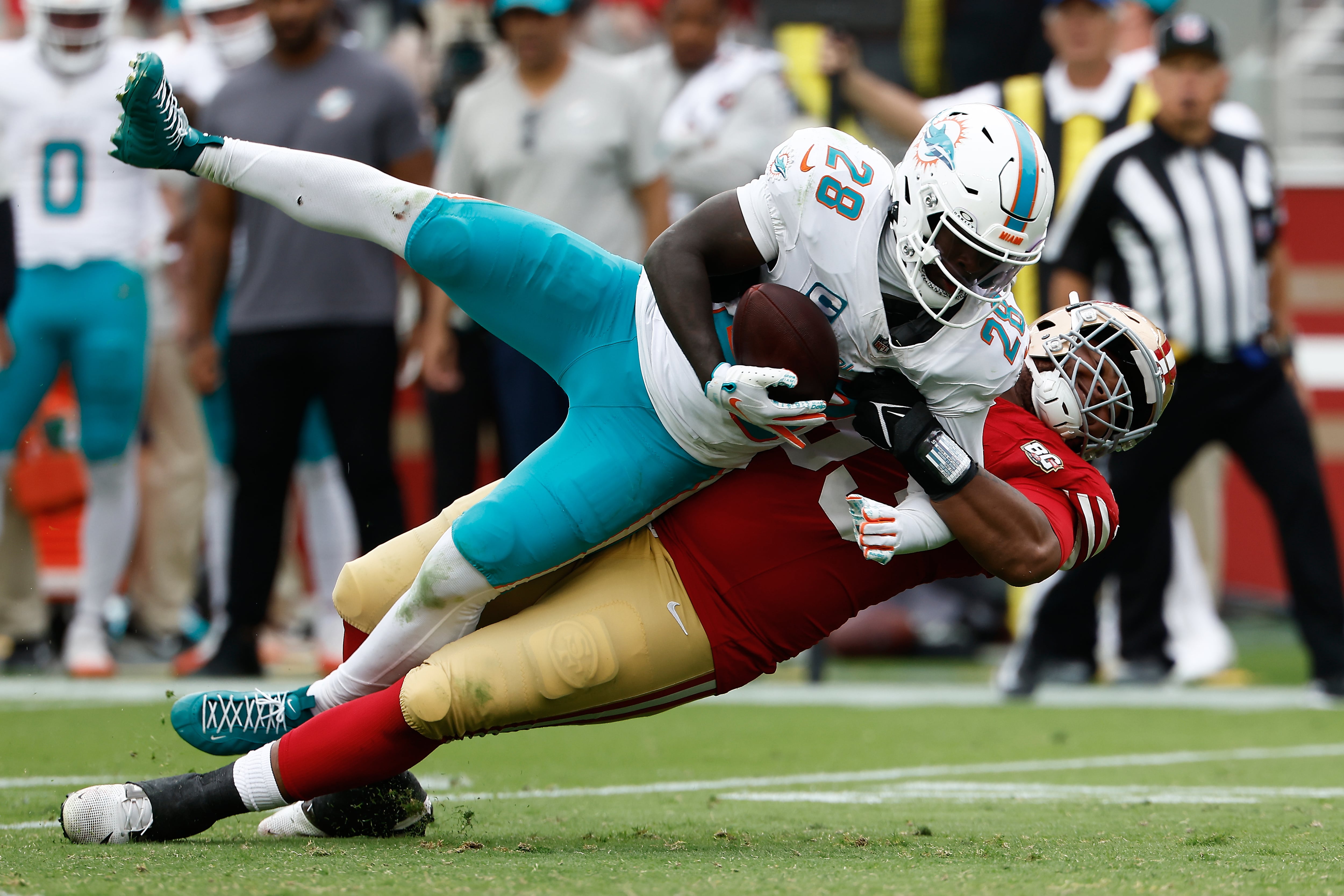 Miami Dolphin star RB DeVon Achane heads to locker room with knee injury