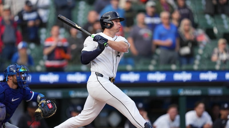 Tigers extend win streak to six by rallying in ninth for rain-delayed victory over Royals