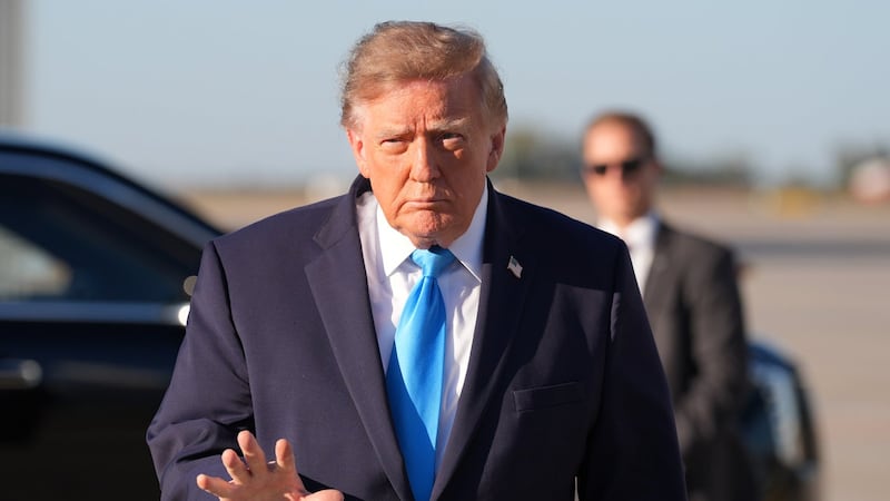 Storm threat churns planning for Georgia-Alabama game with Trump set to attend